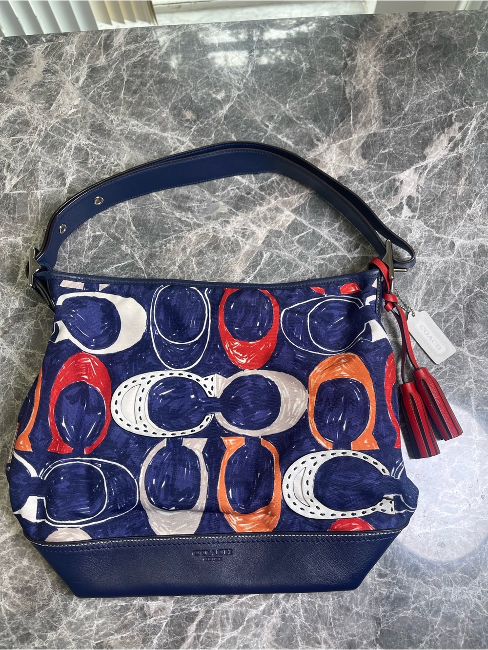 Coach Navy Signature Print Shoulder Bag with Red and Orange Tassel